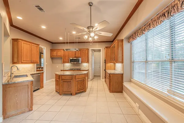 a view of cabinets and window