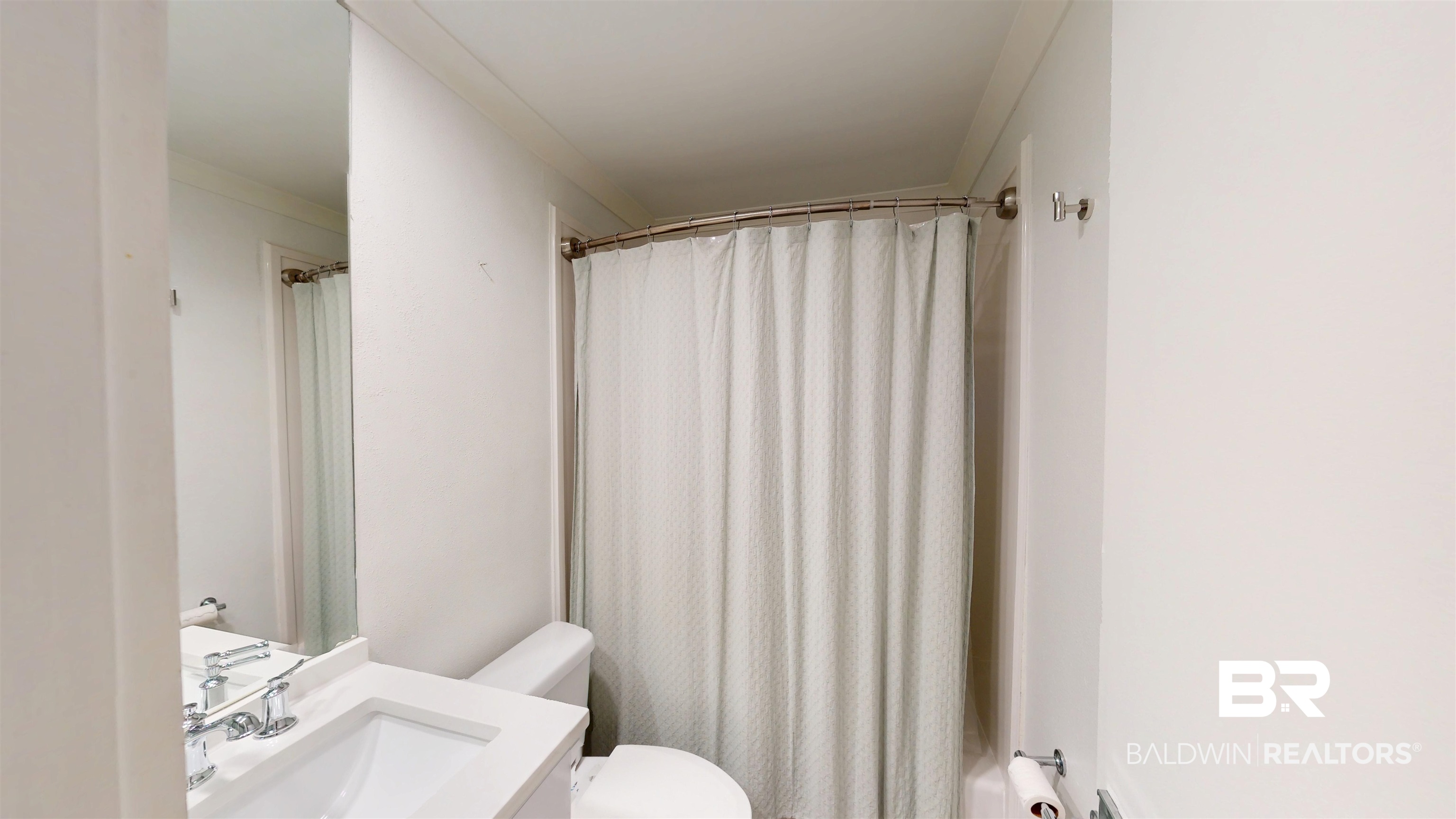 3655 Old Shell Road, Unit 219 Mobile, AL 36608 - Photo 8 of 25 Bathroom with vanity and a shower with shower curtain