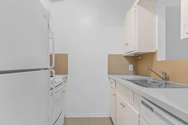 a bedroom with a bed and a chair