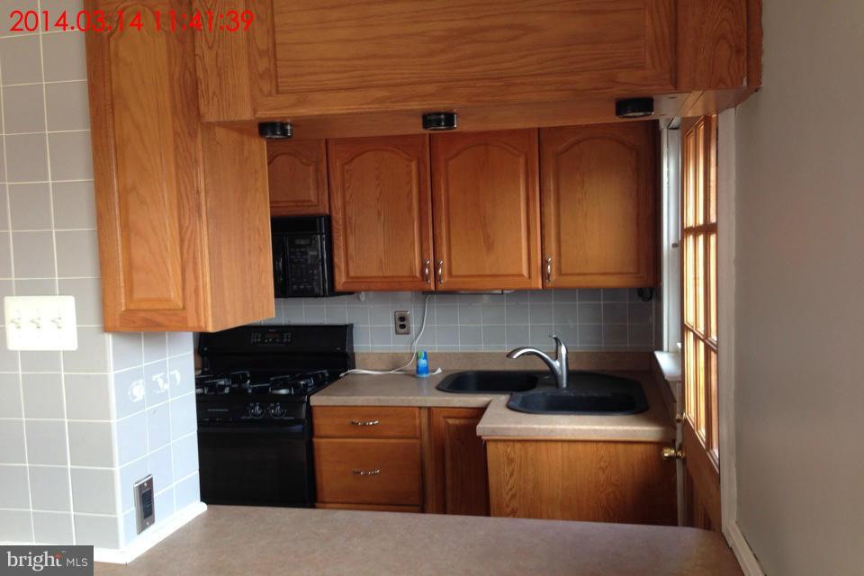 314 Stemmers Run Road Baltimore, MD 21221 - Photo 5 of 13 a kitchen with stainless steel appliances granite countertop a refrigerator stove and sink