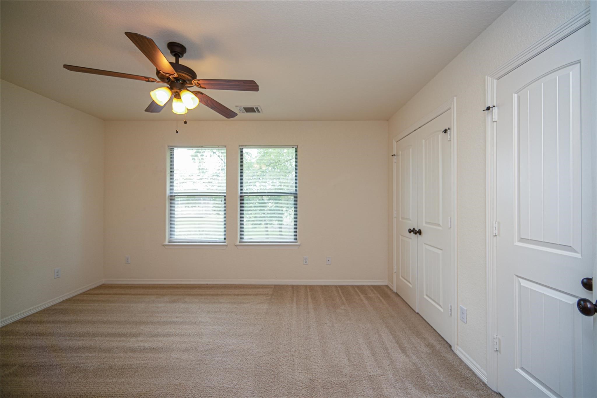 1426 April Villas, Unit A Conroe, TX 77356 - Photo 7 of 8 a view of an empty room with a window
