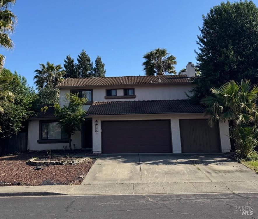 a house view with a garden space