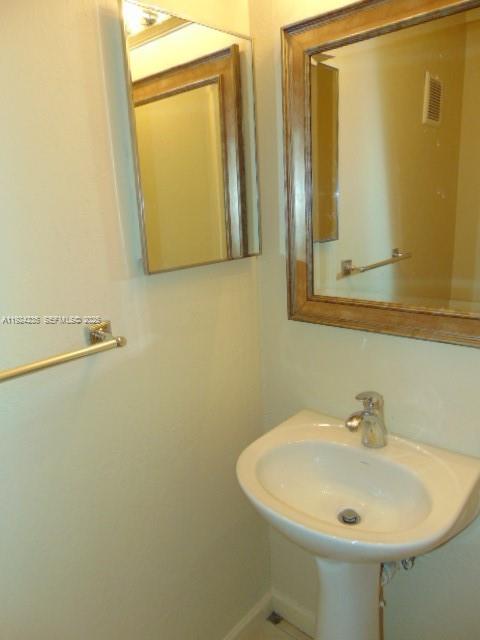 1774 Southwest 81st Terrace, Unit 137 Davie, FL 33324 - Photo 17 of 23 Downstairs half bath