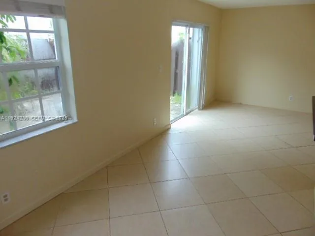 a view of empty room with windows