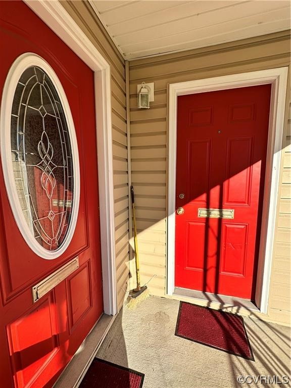 Undisclosed Address Richmond, VA 23222 - Photo 2 of 15 a view of a door with a red door and a chair