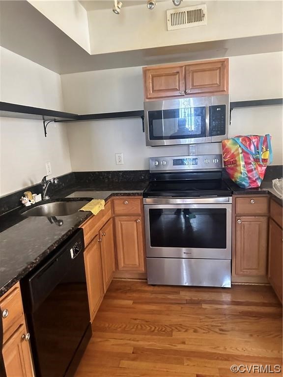 Undisclosed Address Richmond, VA 23222 - Photo 4 of 15 a kitchen with stainless steel appliances granite countertop a stove and a sink