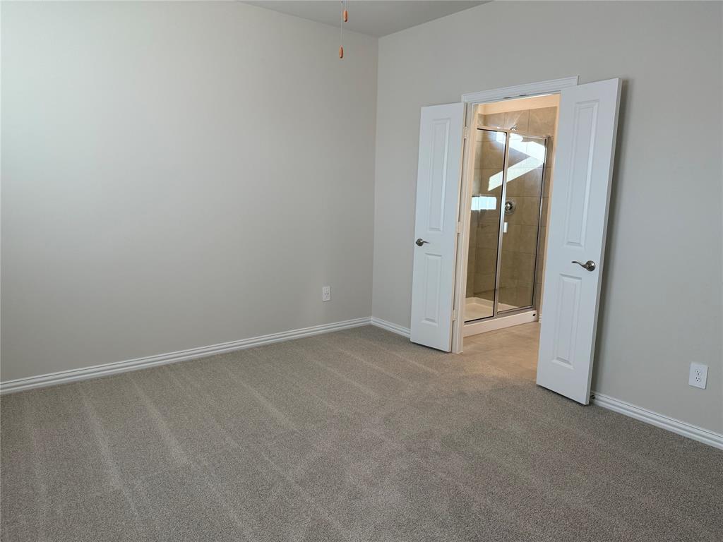 1736 Arches Road Anna, TX 75409 - Photo 5 of 18 Carpeted empty room featuring baseboards