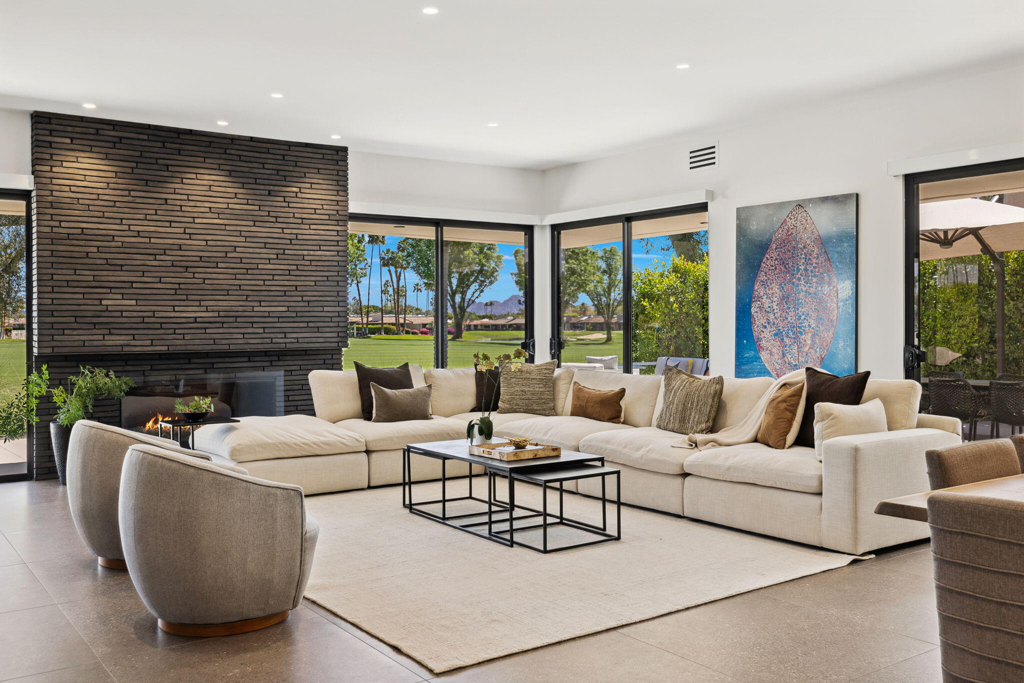 20 Lafayette Drive Rancho Mirage, CA 92270 - Photo 1 of 48 a living room with fireplace furniture and a large window