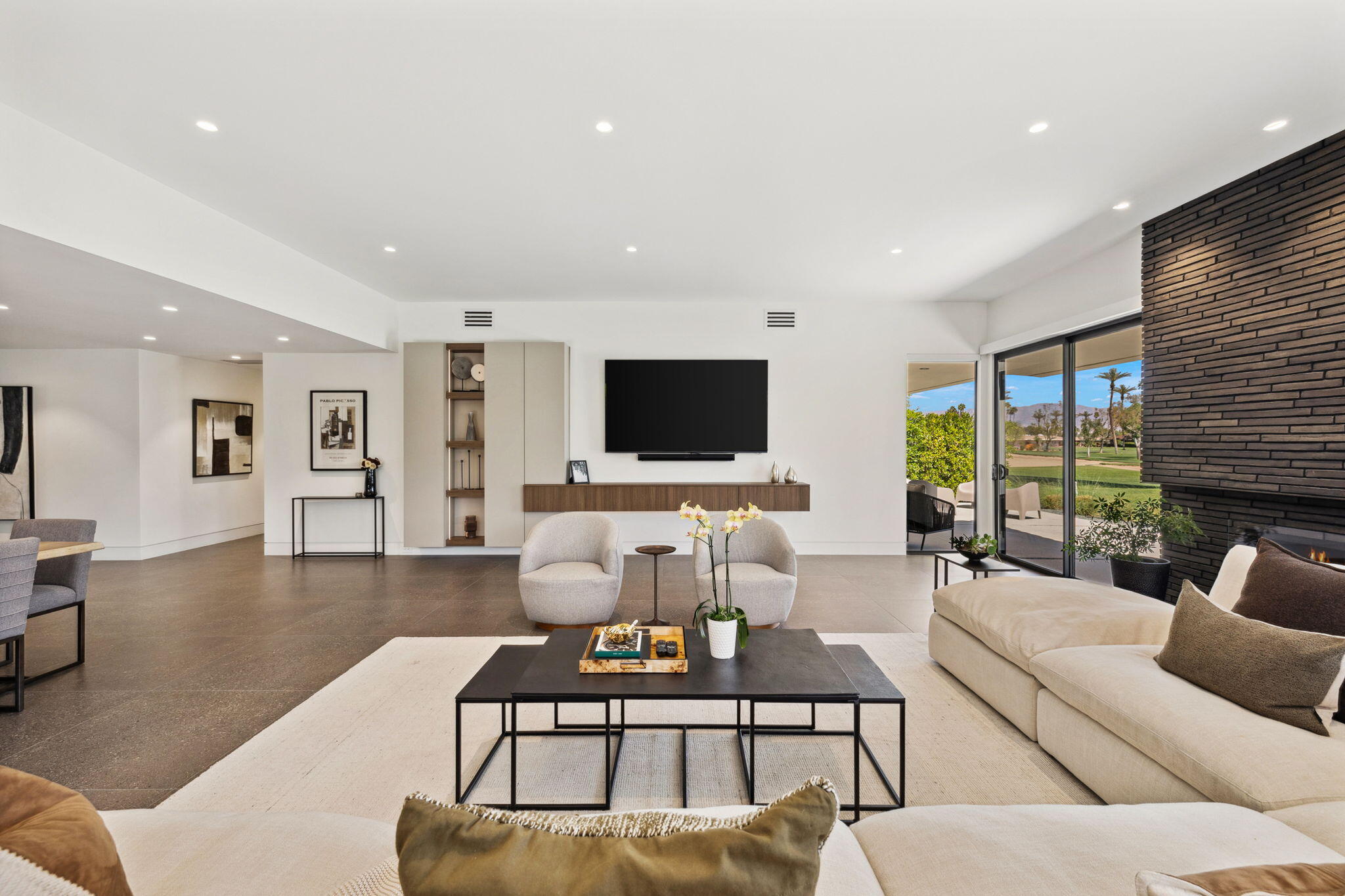 20 Lafayette Drive Rancho Mirage, CA 92270 - Photo 11 of 48 a living room with furniture and a flat screen tv