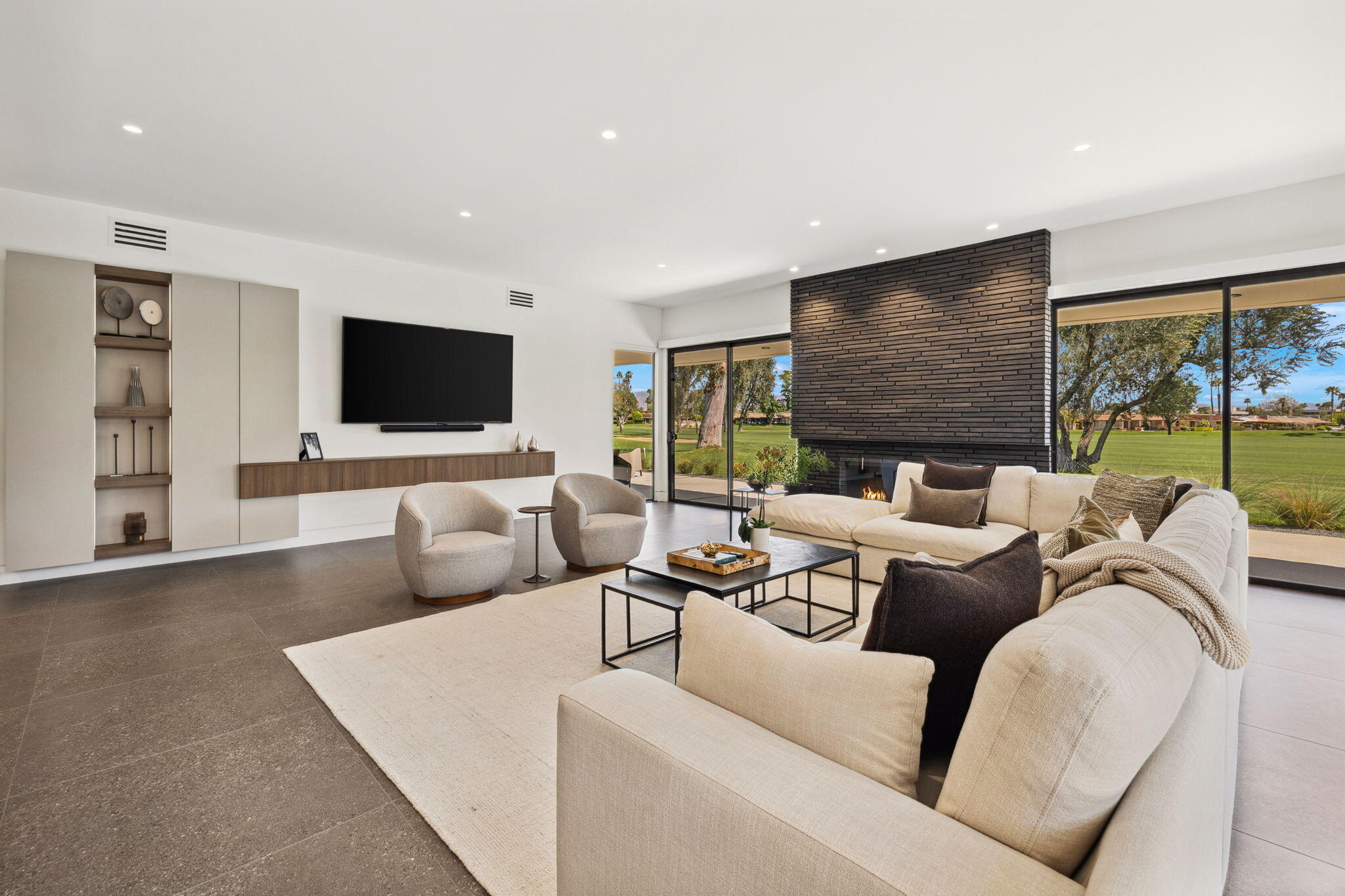20 Lafayette Drive Rancho Mirage, CA 92270 - Photo 13 of 48 a living room with furniture and a flat screen tv