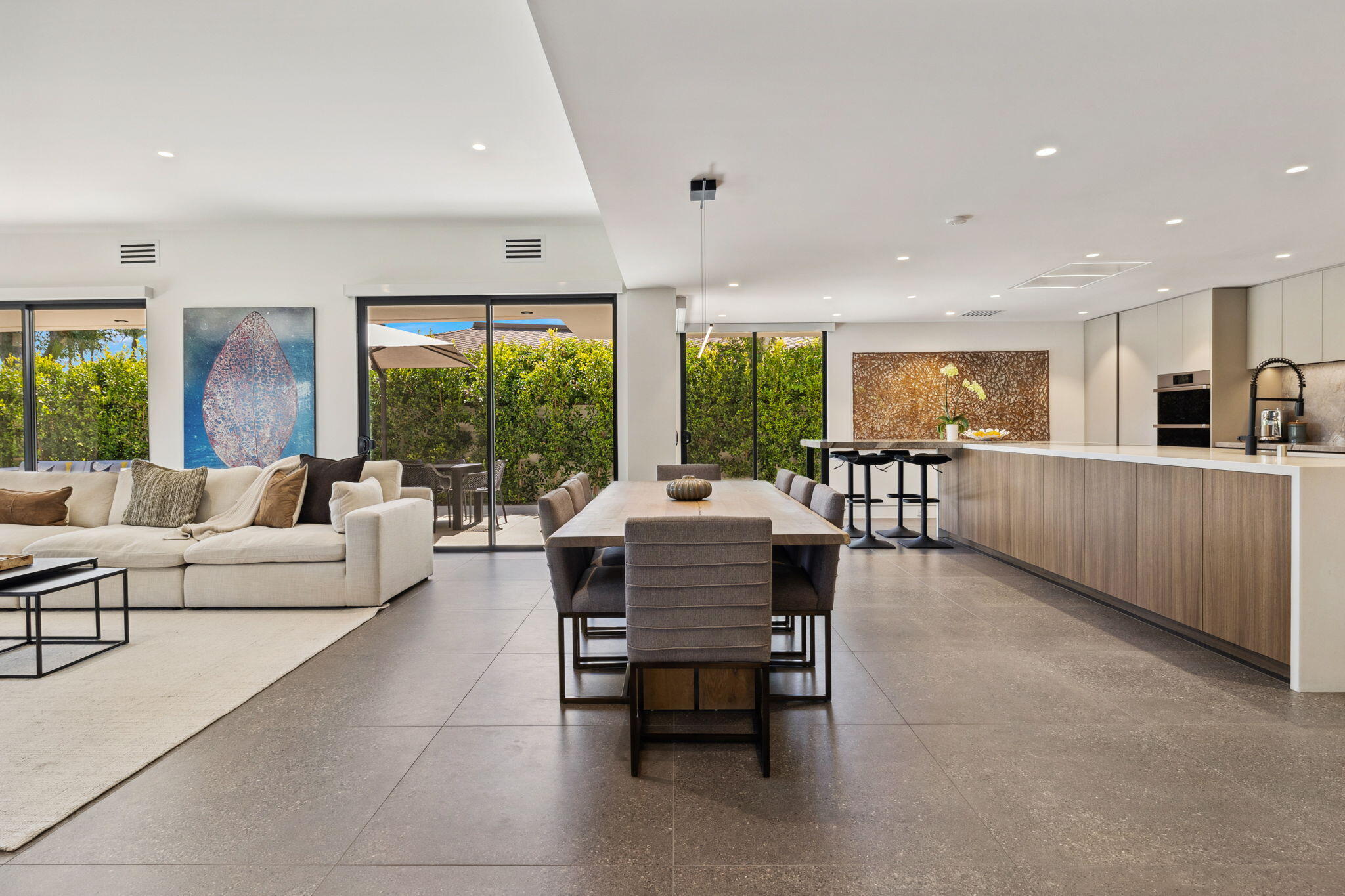 20 Lafayette Drive Rancho Mirage, CA 92270 - Photo 16 of 48 a living room with furniture and large windows
