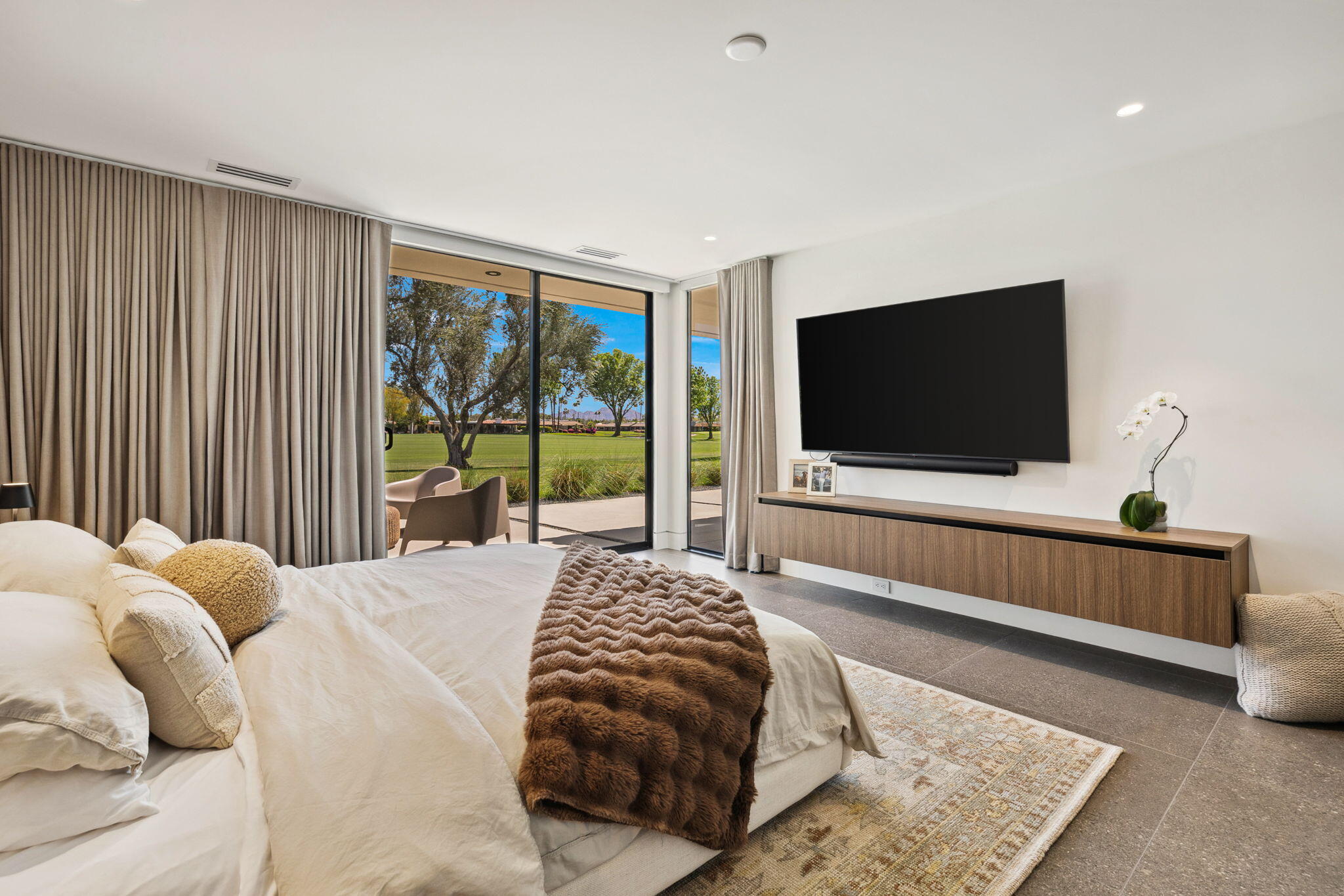 20 Lafayette Drive Rancho Mirage, CA 92270 - Photo 22 of 48 a bedroom with a bed and a flat screen tv