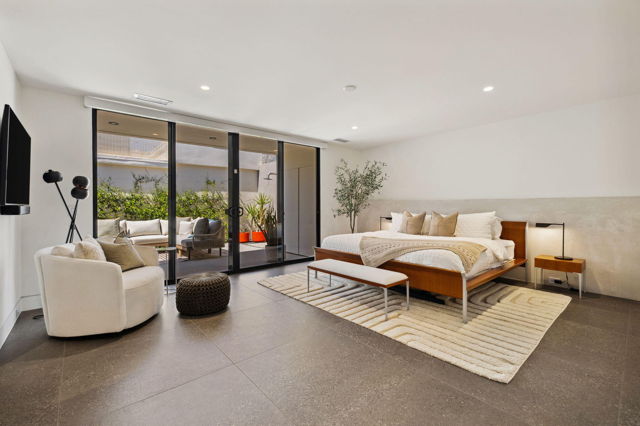 20 Lafayette Drive Rancho Mirage, CA 92270 - Photo 25 of 48 a spacious bedroom with a bed and glass window