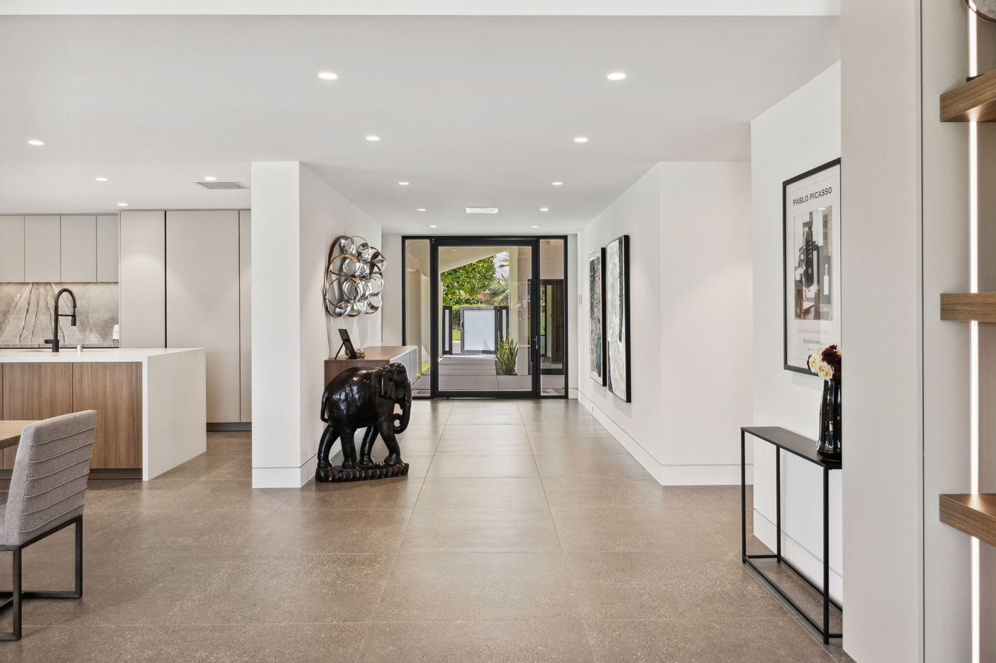 20 Lafayette Drive Rancho Mirage, CA 92270 - Photo 31 of 48 a hallway with a large mirror and furniture