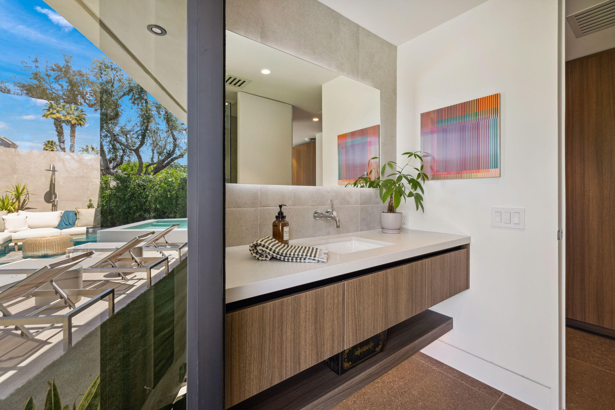 20 Lafayette Drive Rancho Mirage, CA 92270 - Photo 4 of 48 a en suite bathroom with a granite countertop sink and a large mirror
