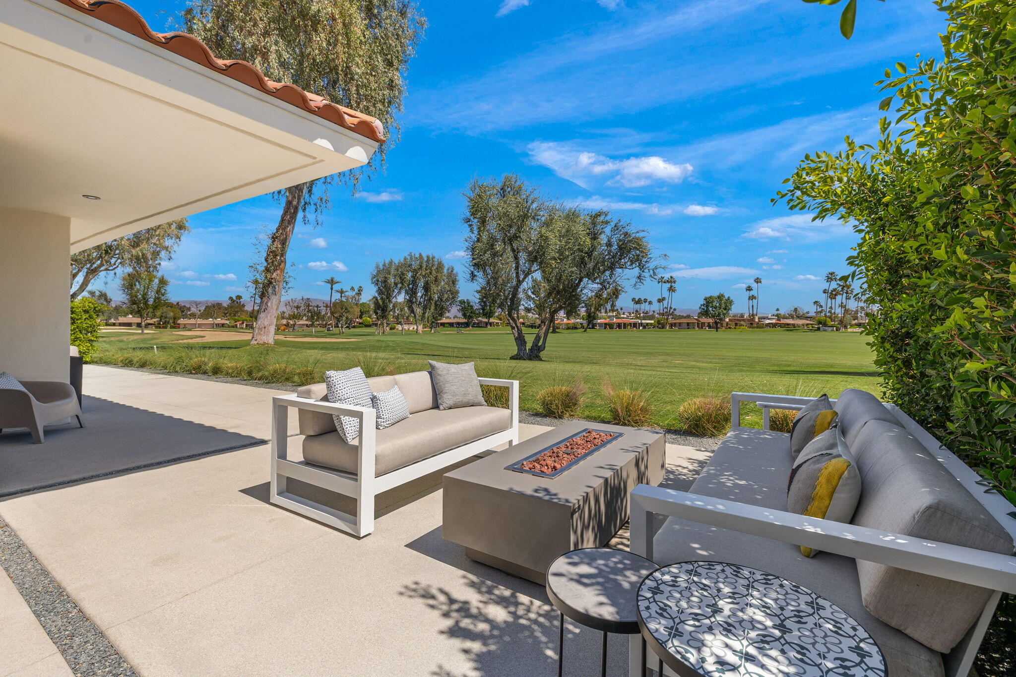 20 Lafayette Drive Rancho Mirage, CA 92270 - Photo 47 of 48 a view of a patio with a table chairs and a fire pit