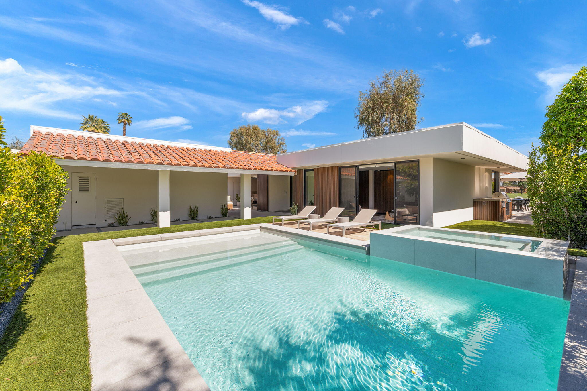 20 Lafayette Drive Rancho Mirage, CA 92270 - Photo 8 of 48 a view of swimming pool with outdoor seating and house in the background