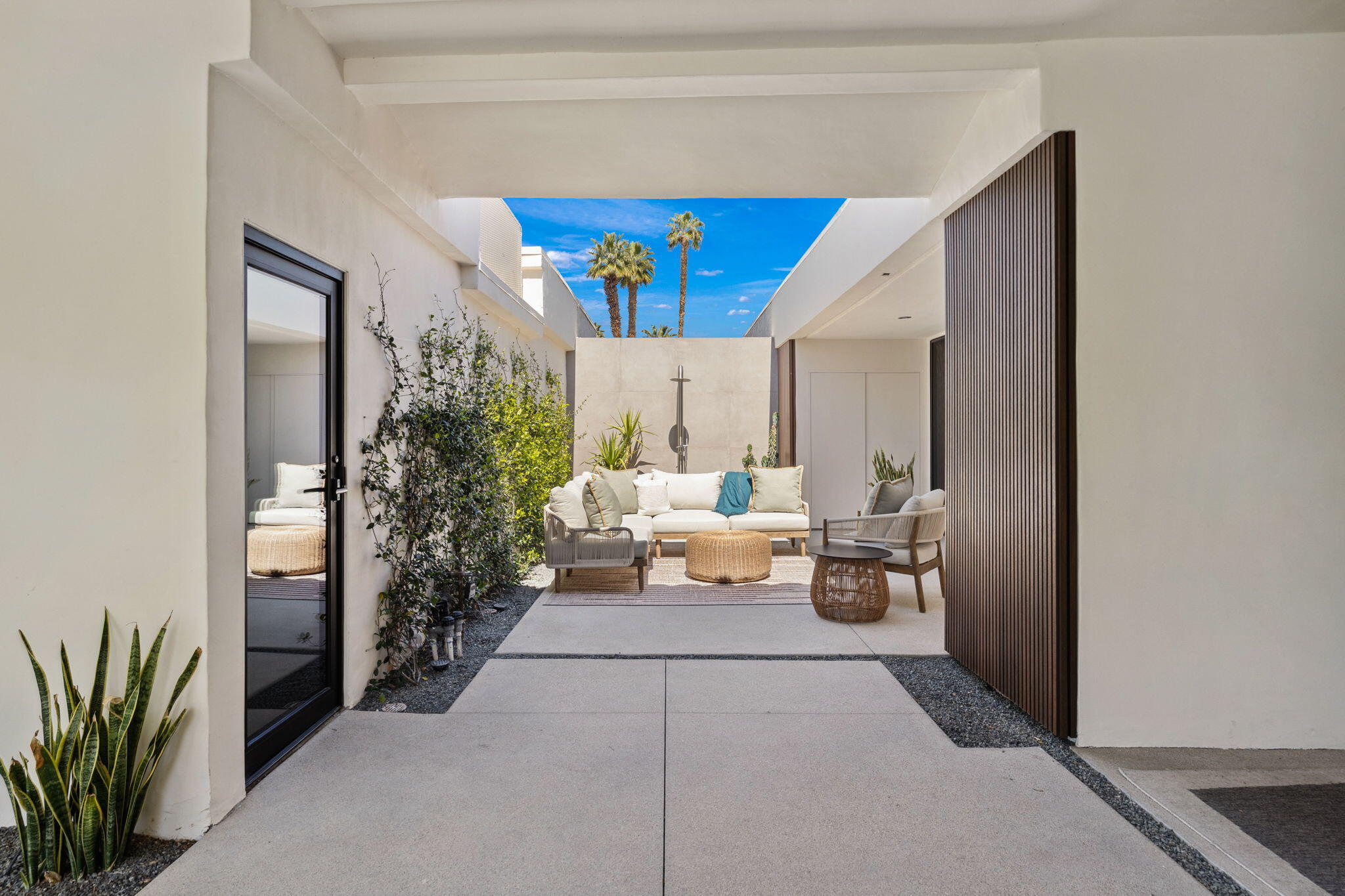 20 Lafayette Drive Rancho Mirage, CA 92270 - Photo 9 of 48 a living room with furniture and a potted plant