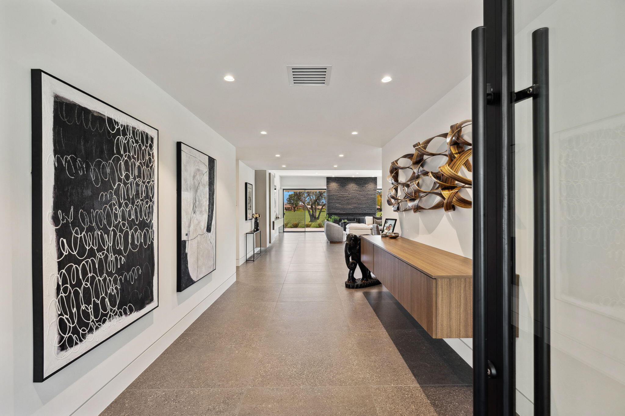 20 Lafayette Drive Rancho Mirage, CA 92270 - Photo 10 of 48 a view of hallway with living room and furniture