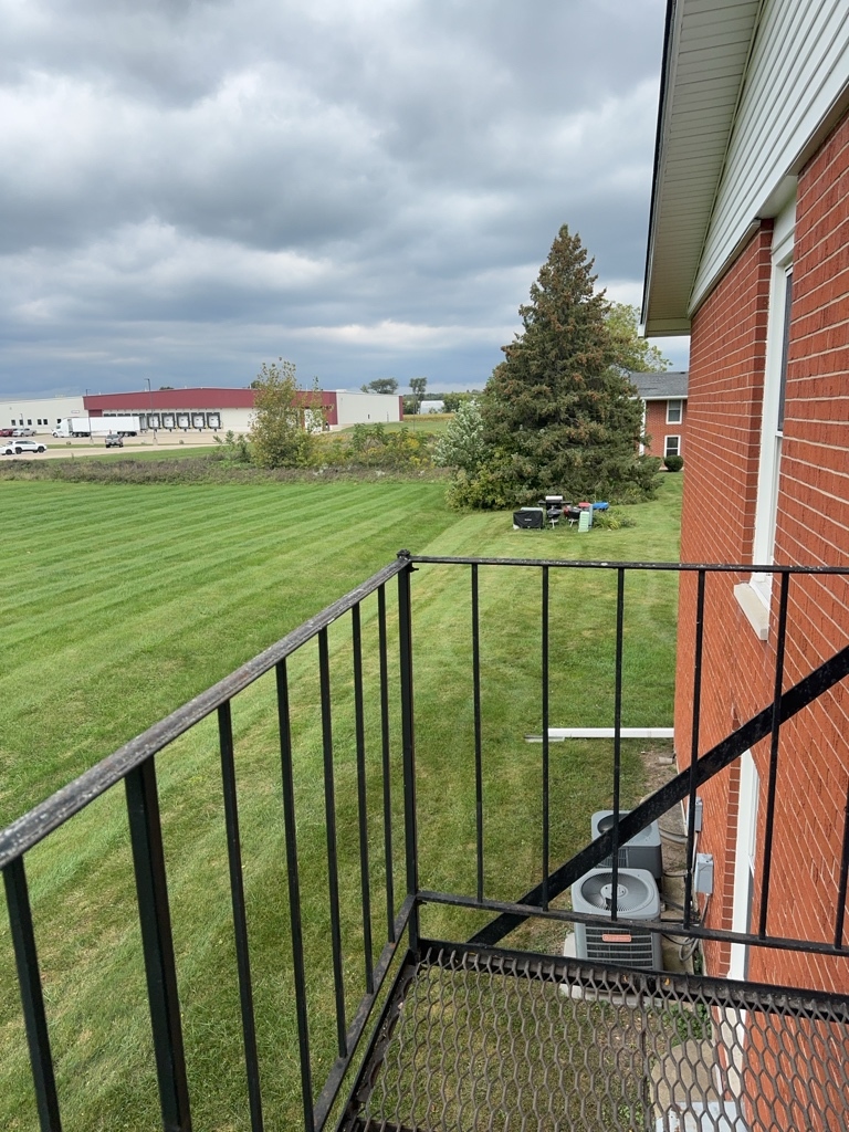 418 Beloit Street, Unit 6 Walworth, WI 53184 - Photo 11 of 23 a view of a balcony with an outdoor space