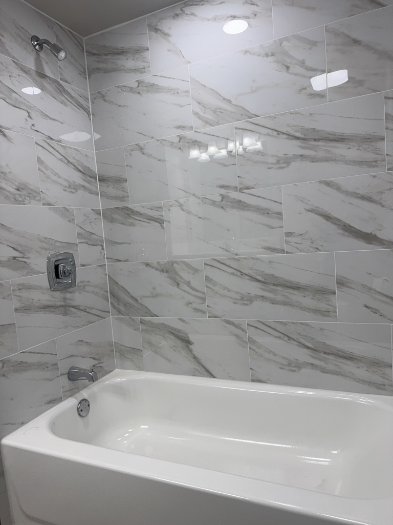 418 Beloit Street, Unit 6 Walworth, WI 53184 - Photo 15 of 23 a bathroom with a bathtub