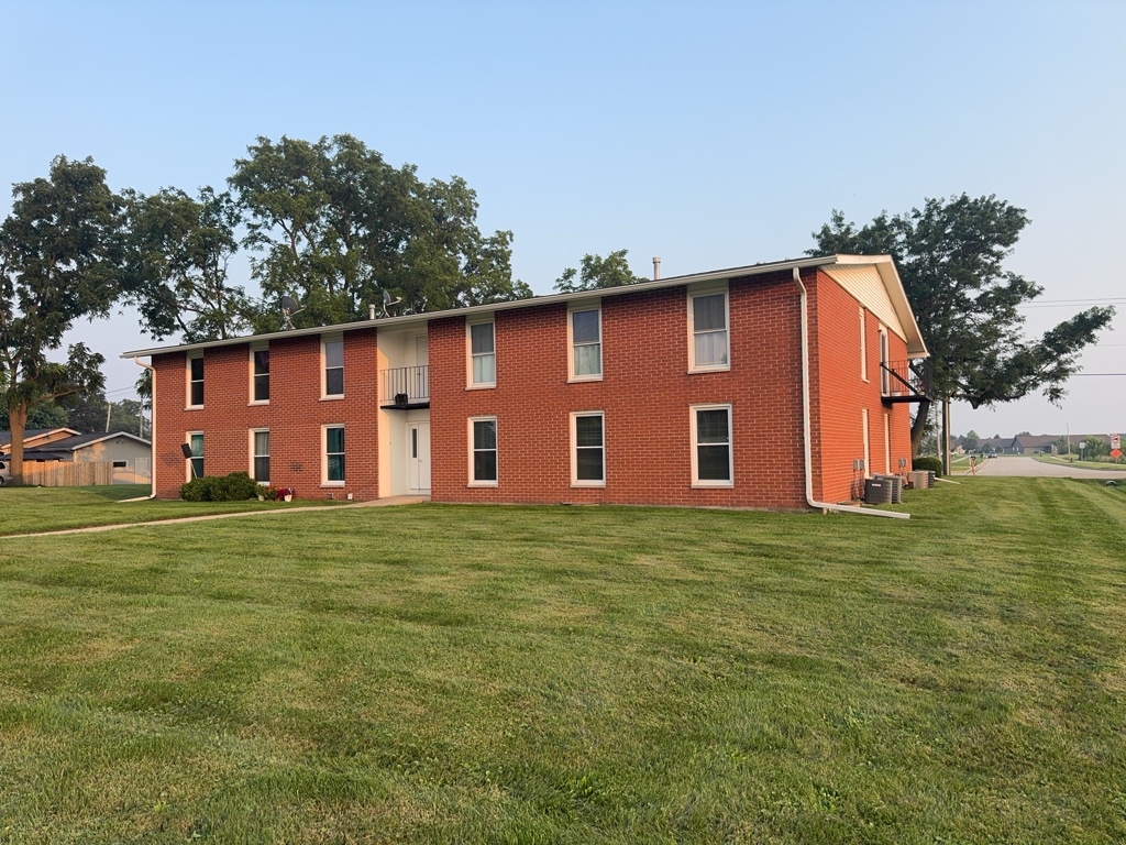 418 Beloit Street, Unit 6 Walworth, WI 53184 - Photo 20 of 23 a front view of a house with garden