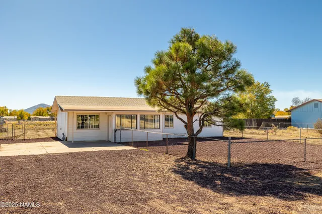 a kitchen with stainless steel appliances granite countertop a sink stove and wooden floor