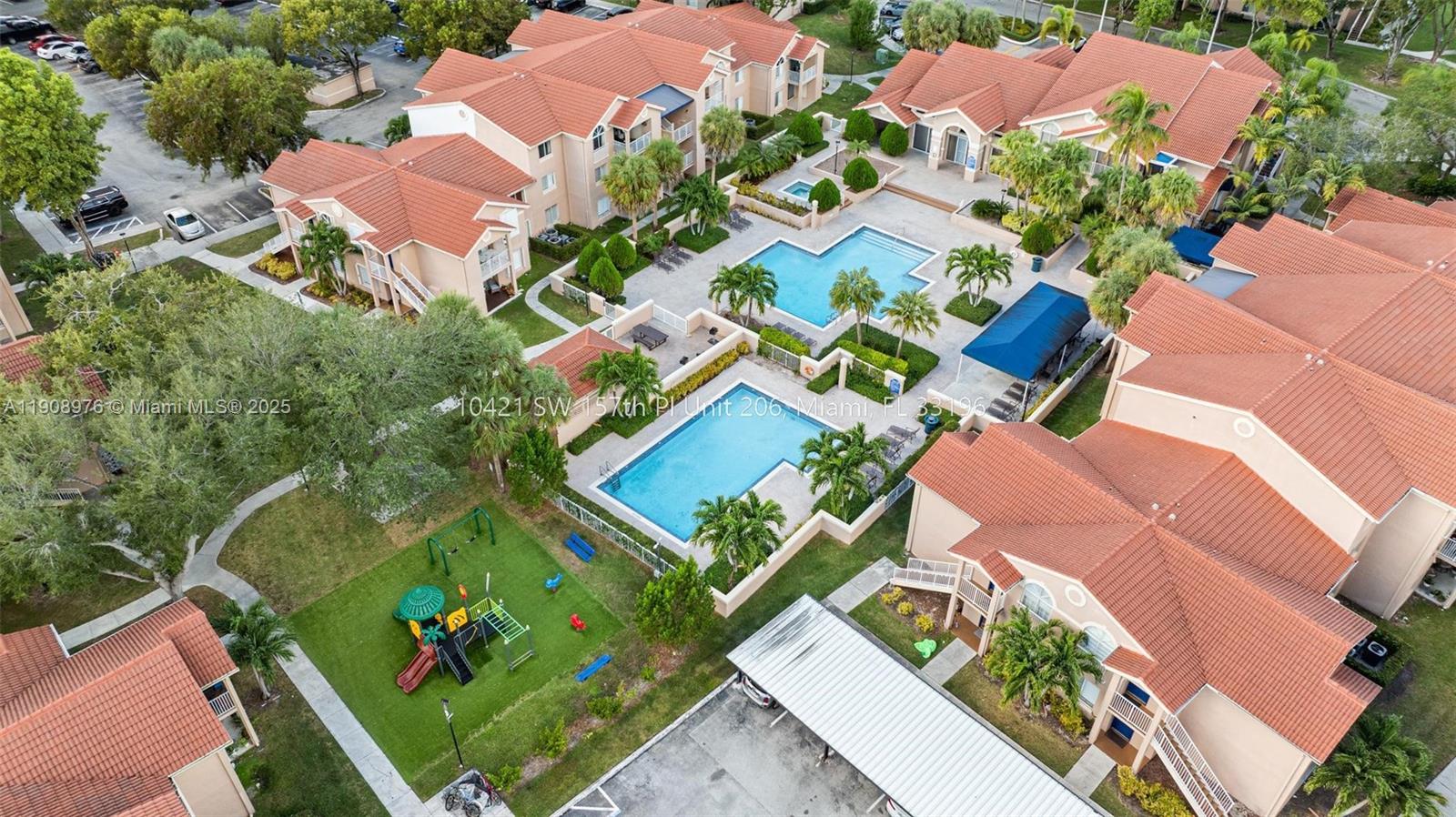 an aerial view of a house with garden space and street view