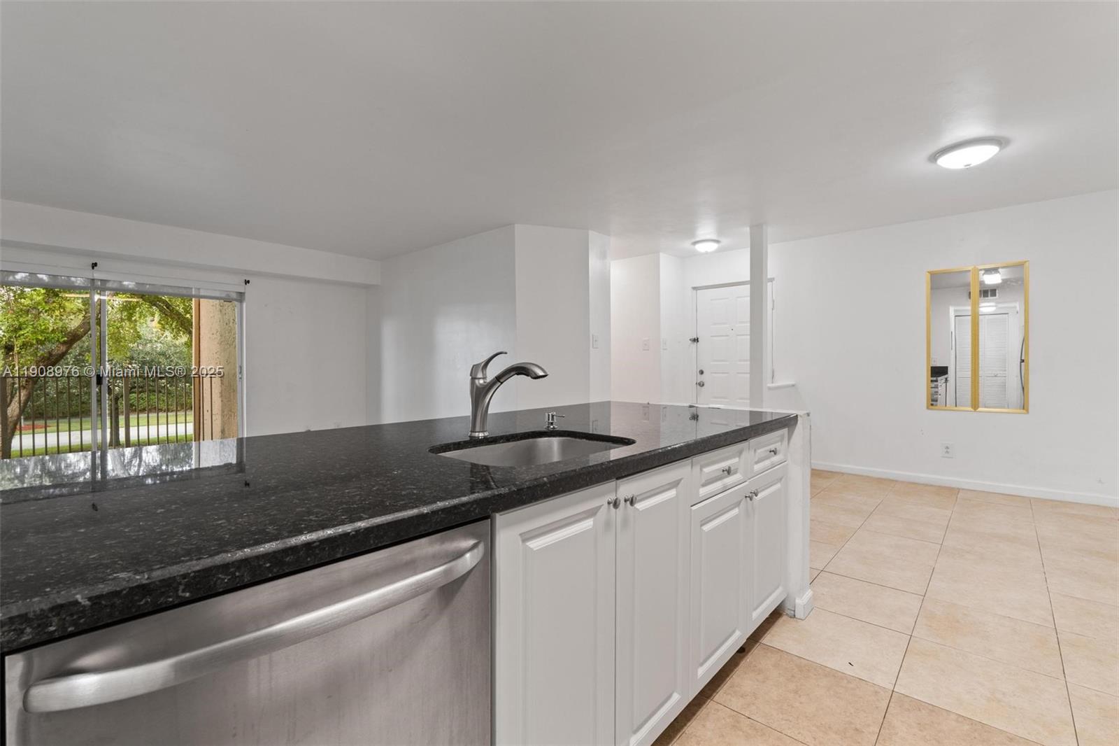 10421 Southwest 157th Place, Unit 206 Miami, FL 33196 - Photo 11 of 35 a kitchen that has a sink and a large window