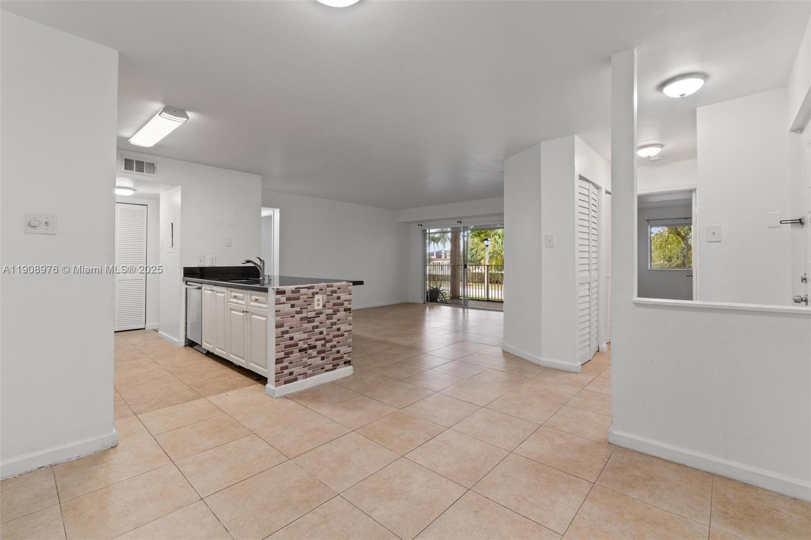 10421 Southwest 157th Place, Unit 206 Miami, FL 33196 - Photo 13 of 35 a large space with white cabinets