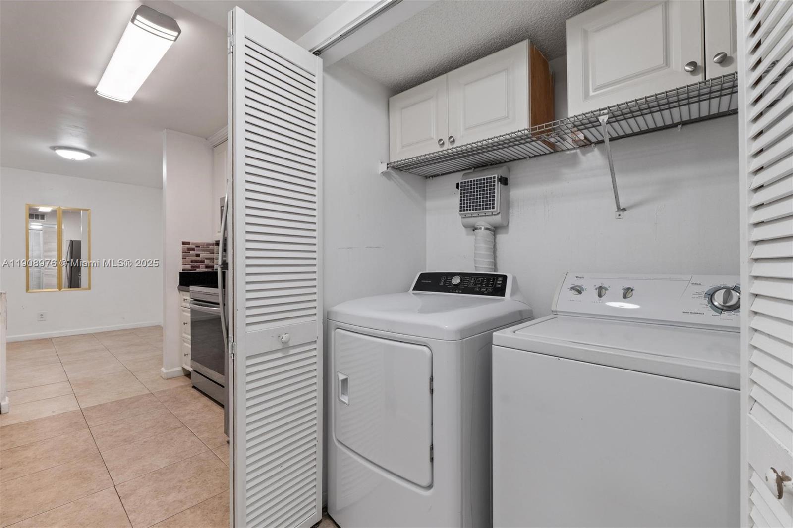 10421 Southwest 157th Place, Unit 206 Miami, FL 33196 - Photo 17 of 35 a utility room with dryer and washer