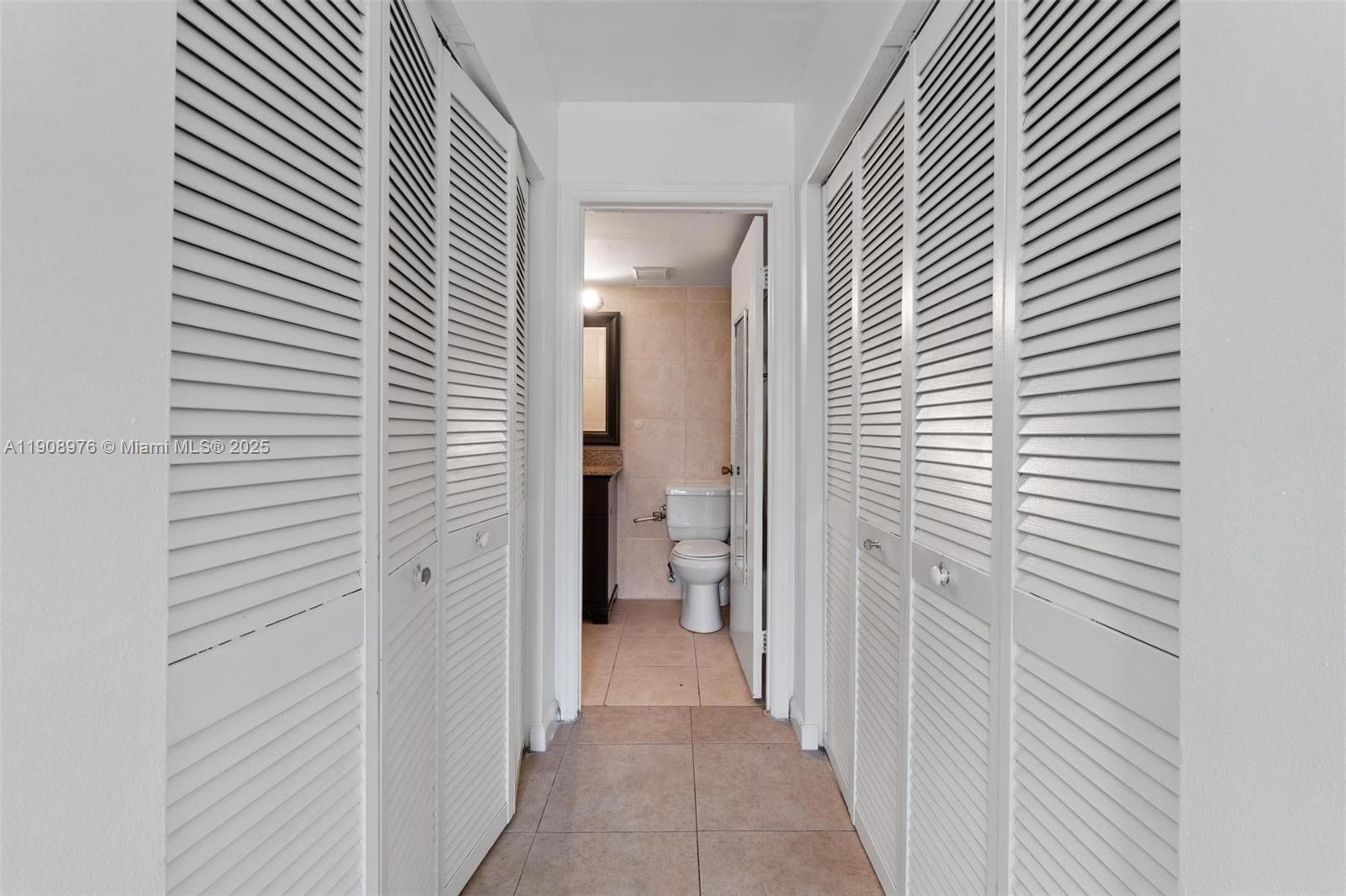 10421 Southwest 157th Place, Unit 206 Miami, FL 33196 - Photo 20 of 35 a view of a bathroom from the hallway