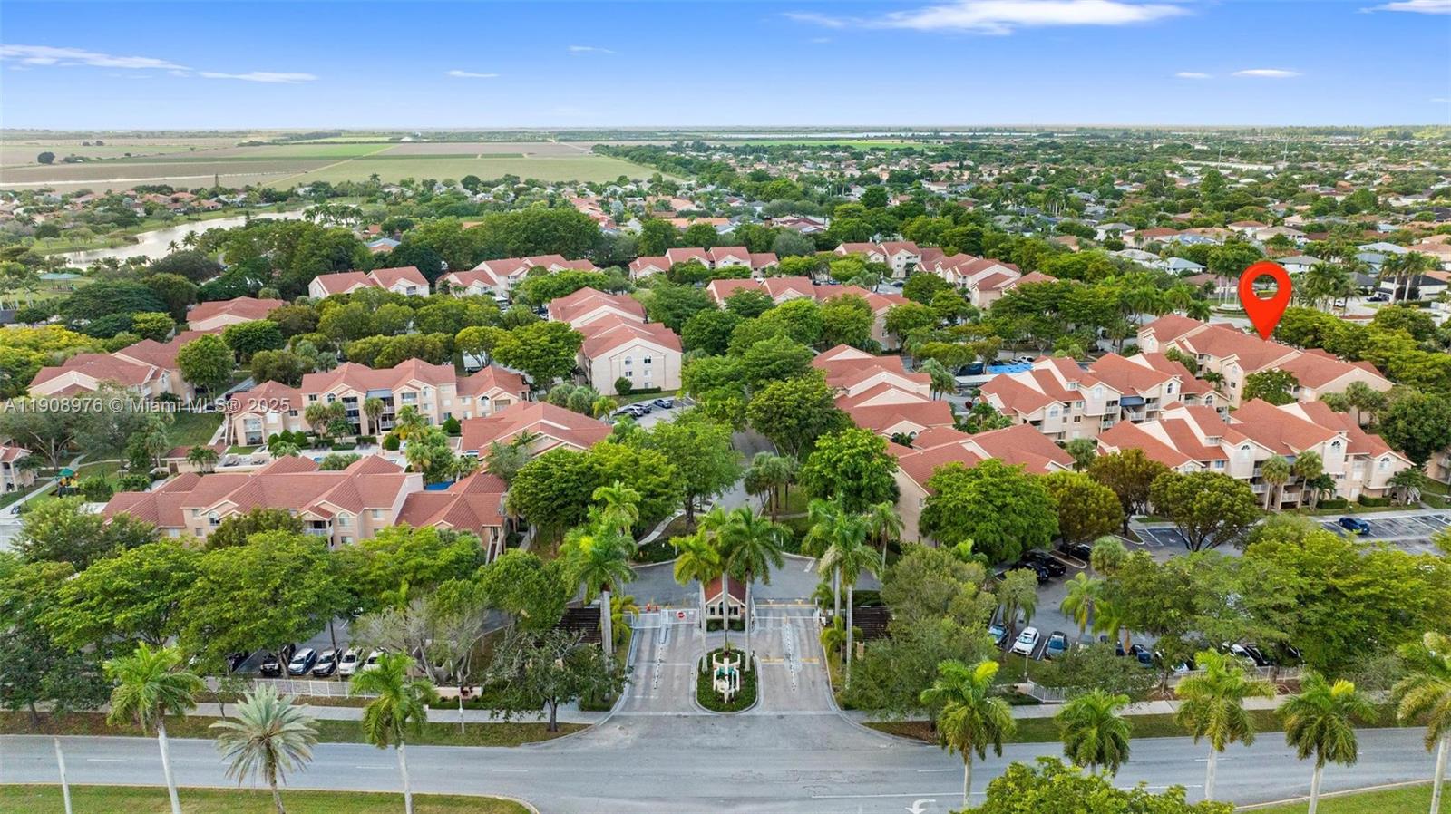 10421 Southwest 157th Place, Unit 206 Miami, FL 33196 - Photo 2 of 35 an aerial view of residential houses with outdoor space and trees