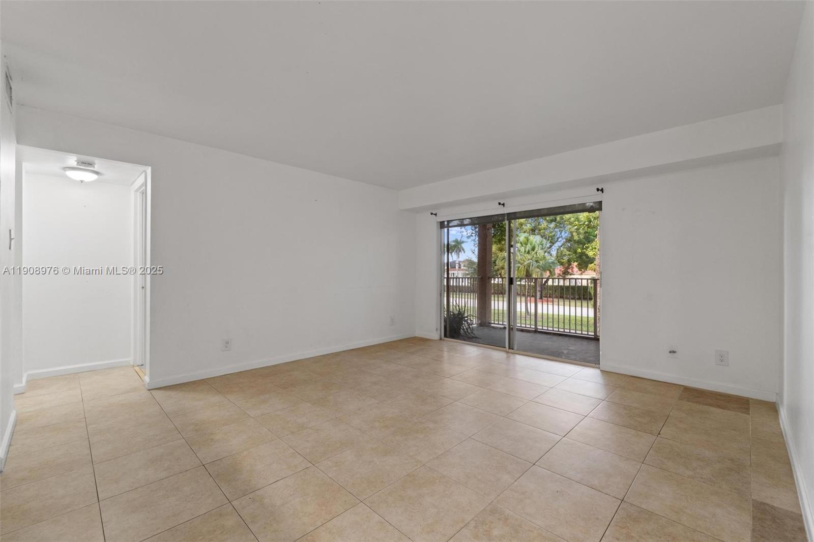 10421 Southwest 157th Place, Unit 206 Miami, FL 33196 - Photo 28 of 35 an empty room with windows