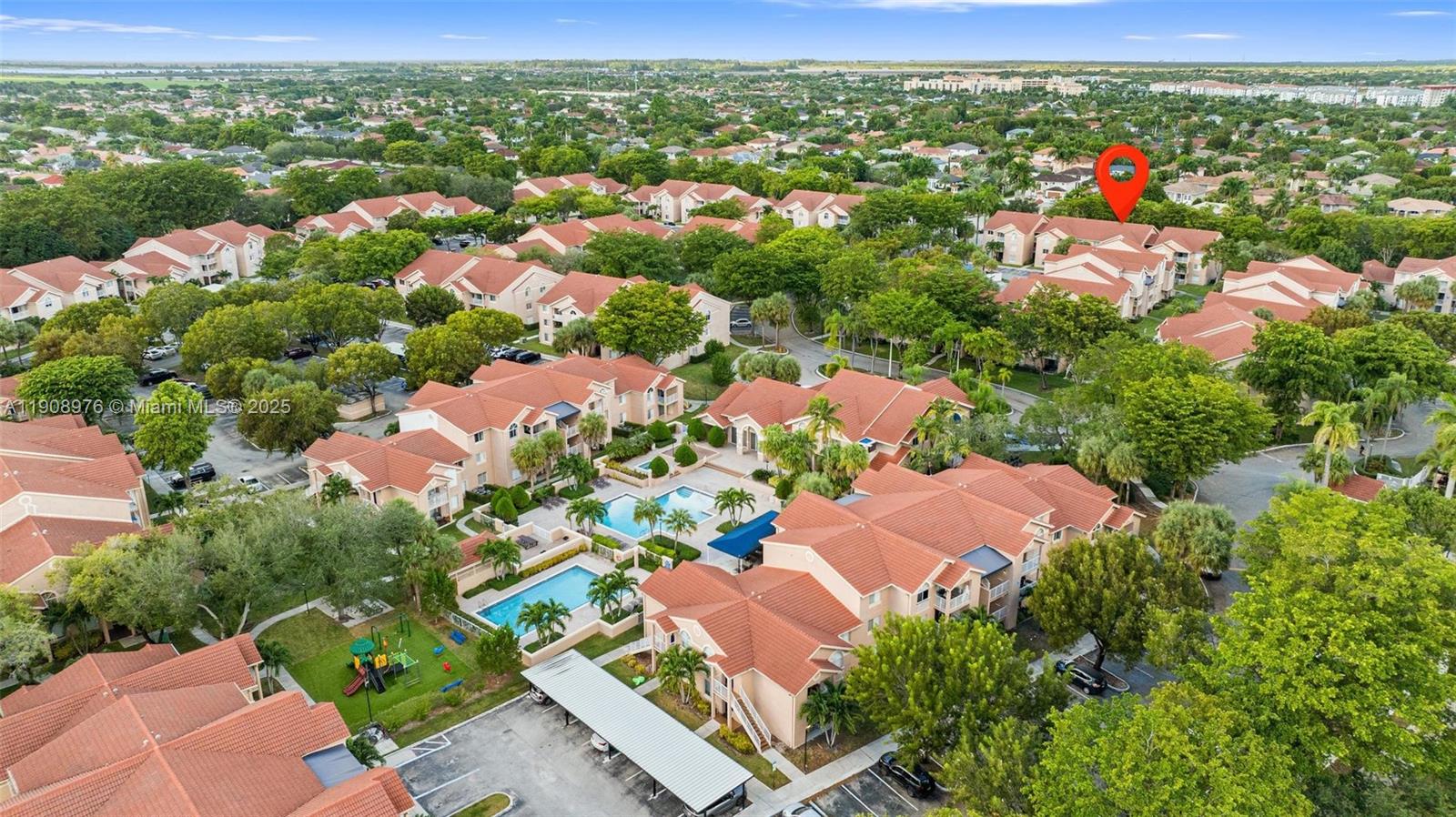 10421 Southwest 157th Place, Unit 206 Miami, FL 33196 - Photo 31 of 35 an aerial view of residential houses with outdoor space and street view