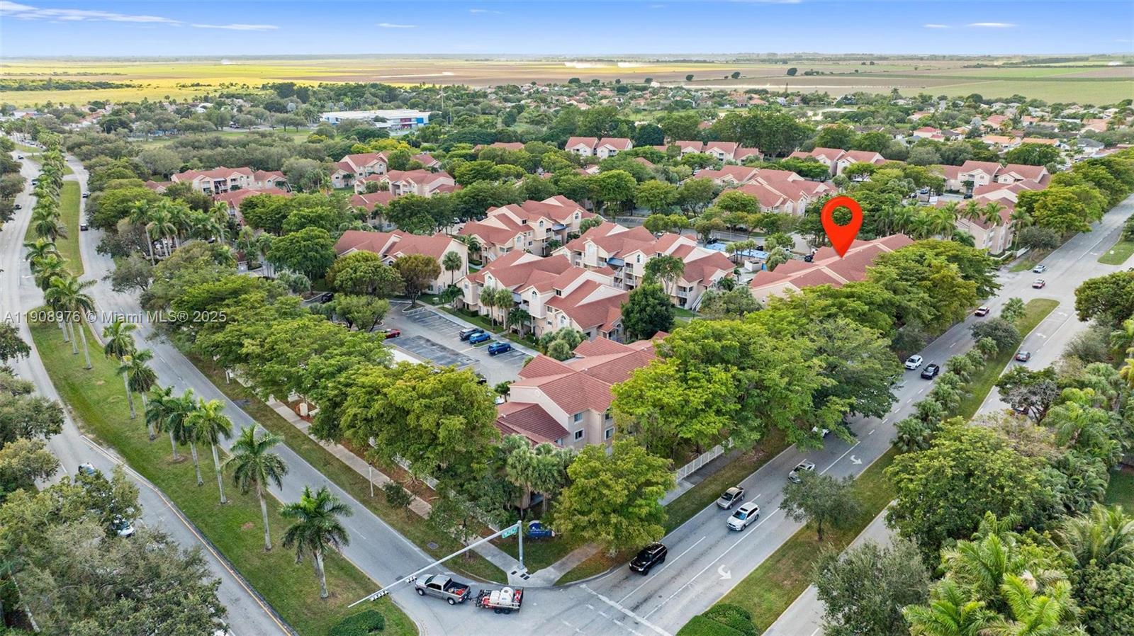 10421 Southwest 157th Place, Unit 206 Miami, FL 33196 - Photo 32 of 35 an aerial view of residential houses with outdoor space and trees