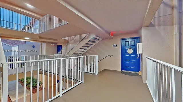 a view of a hallway with stairs