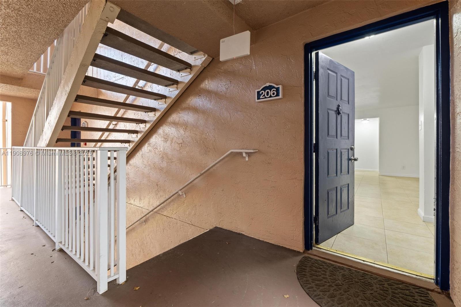 10421 Southwest 157th Place, Unit 206 Miami, FL 33196 - Photo 6 of 35 a view of front door