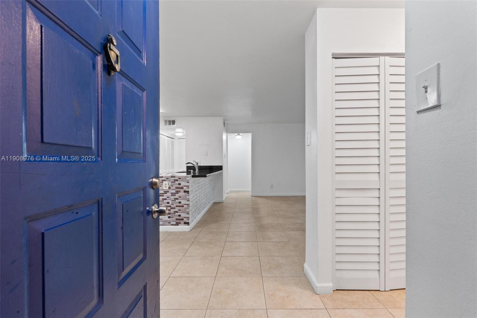 10421 Southwest 157th Place, Unit 206 Miami, FL 33196 - Photo 7 of 35 a view of cabinets and entryway