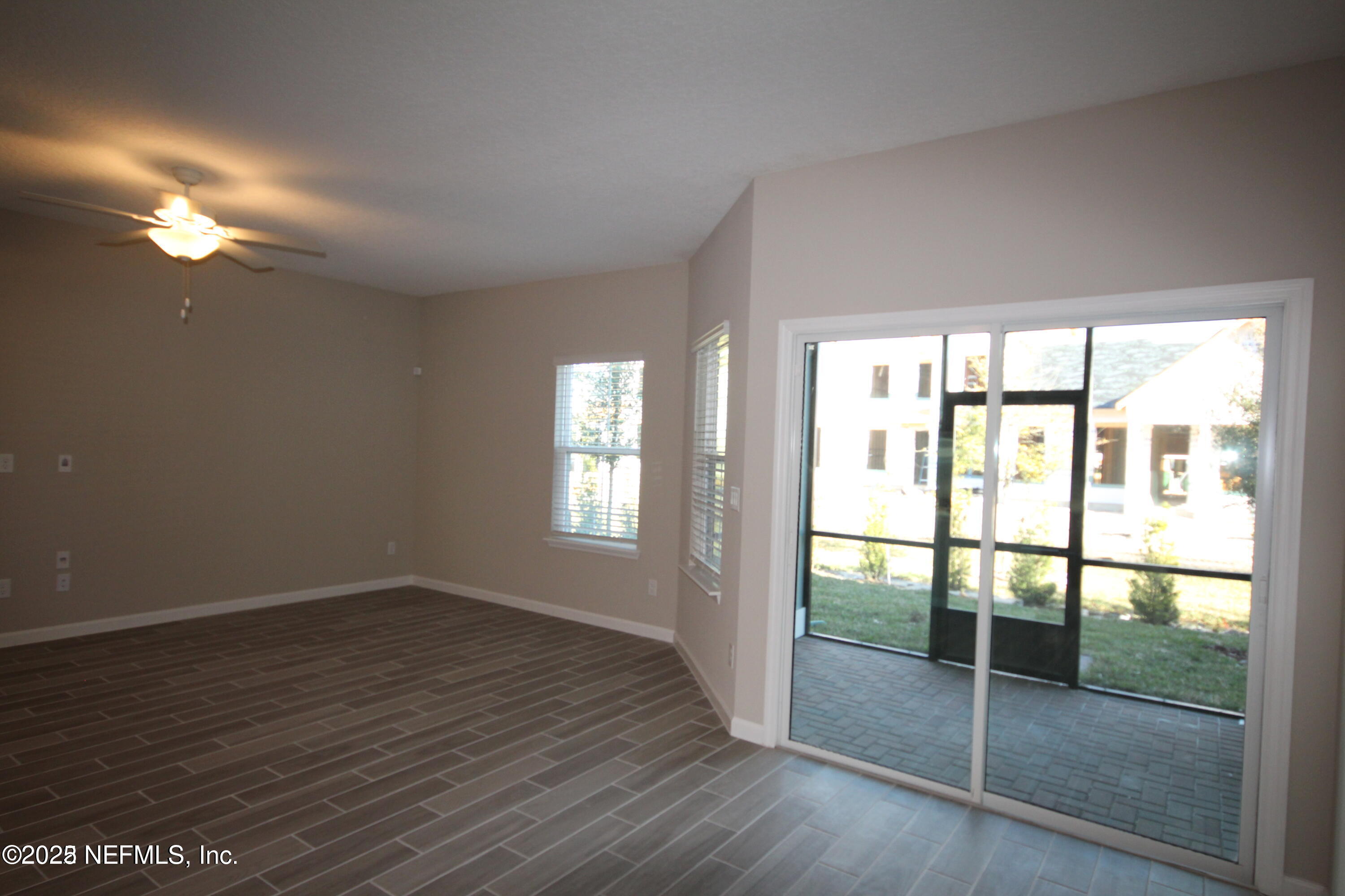 98 Boracay Circle St. Johns, FL 32259 - Photo 12 of 22 a view of empty room with wooden floor and fan