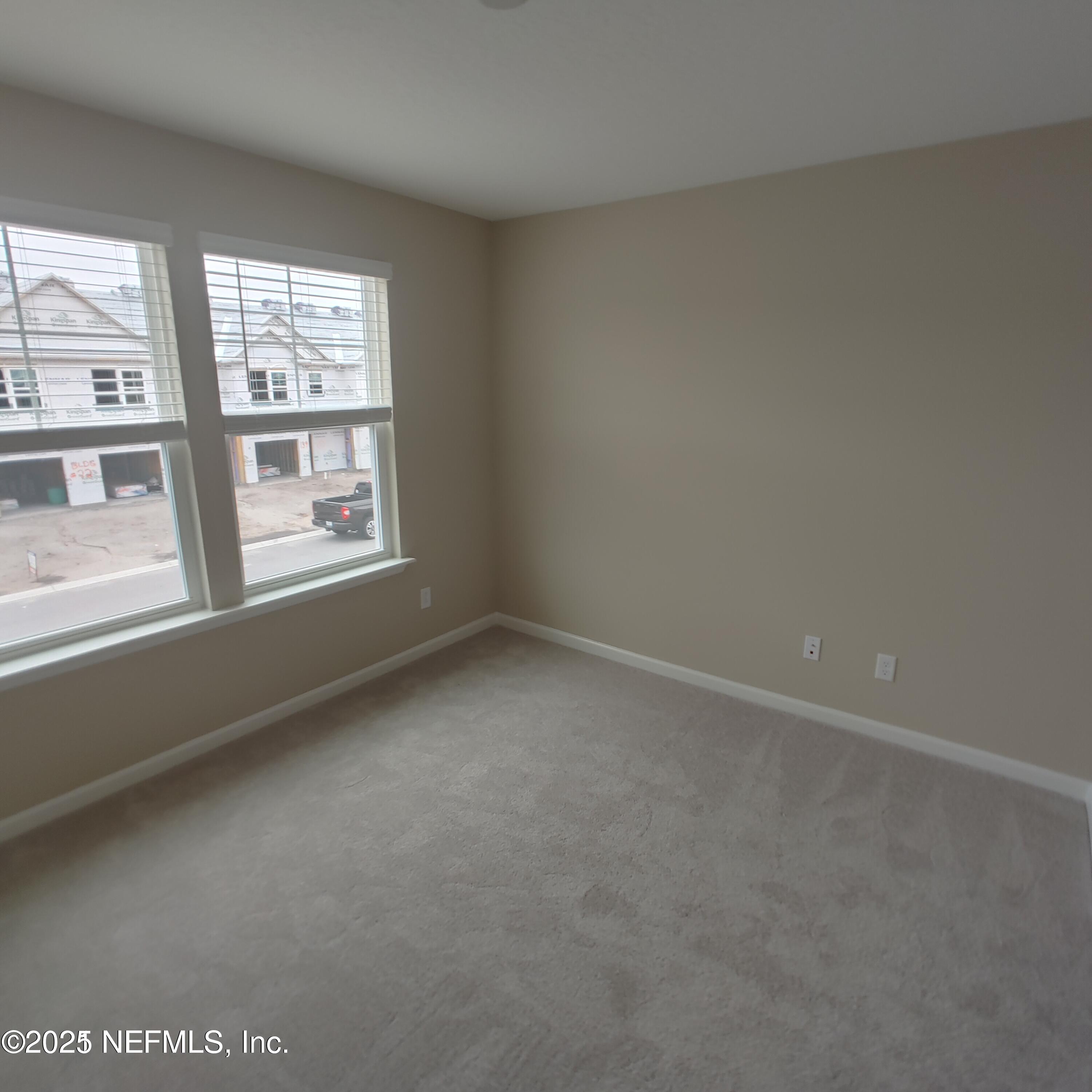 98 Boracay Circle St. Johns, FL 32259 - Photo 14 of 22 an empty room with a window