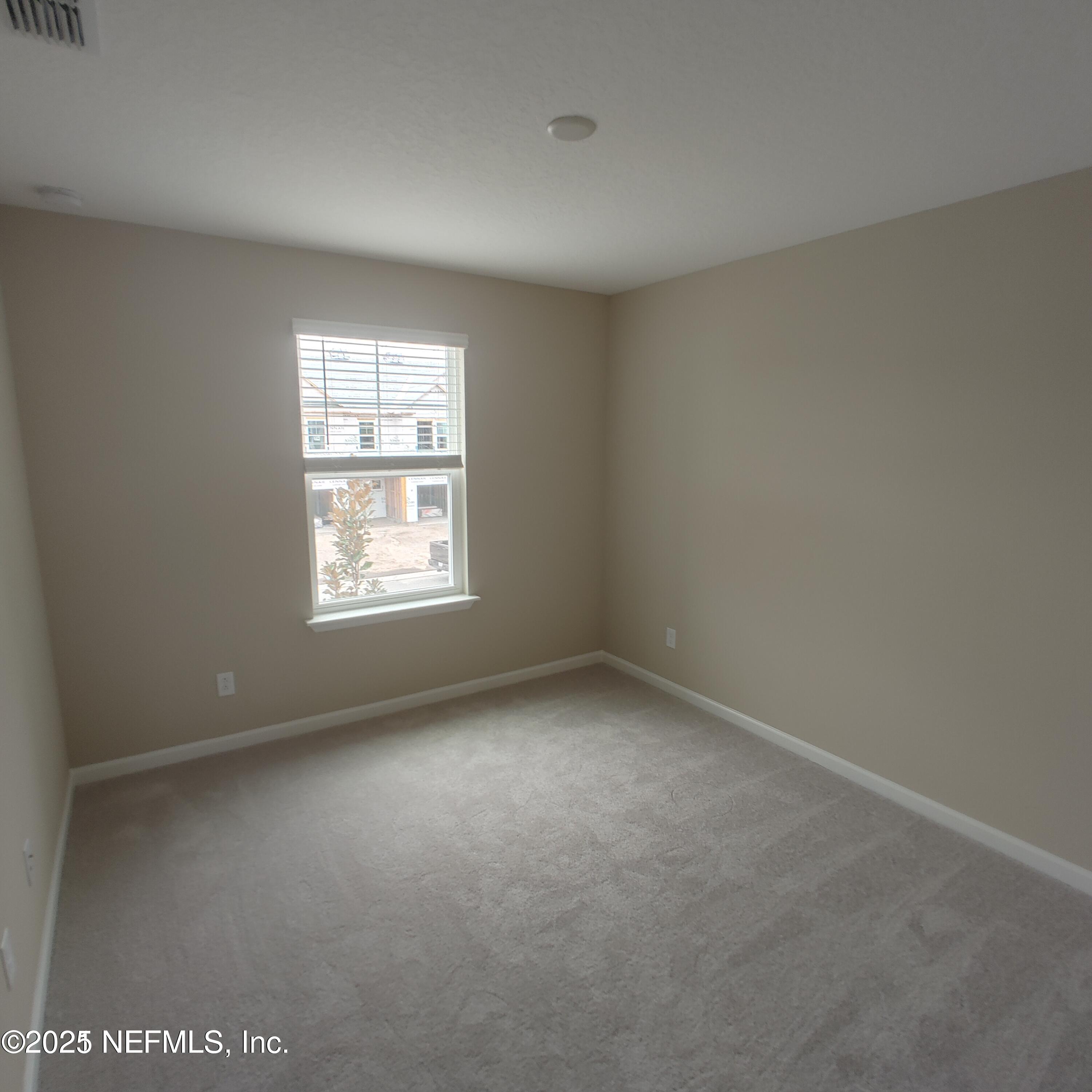 98 Boracay Circle St. Johns, FL 32259 - Photo 16 of 22 an empty room with a window