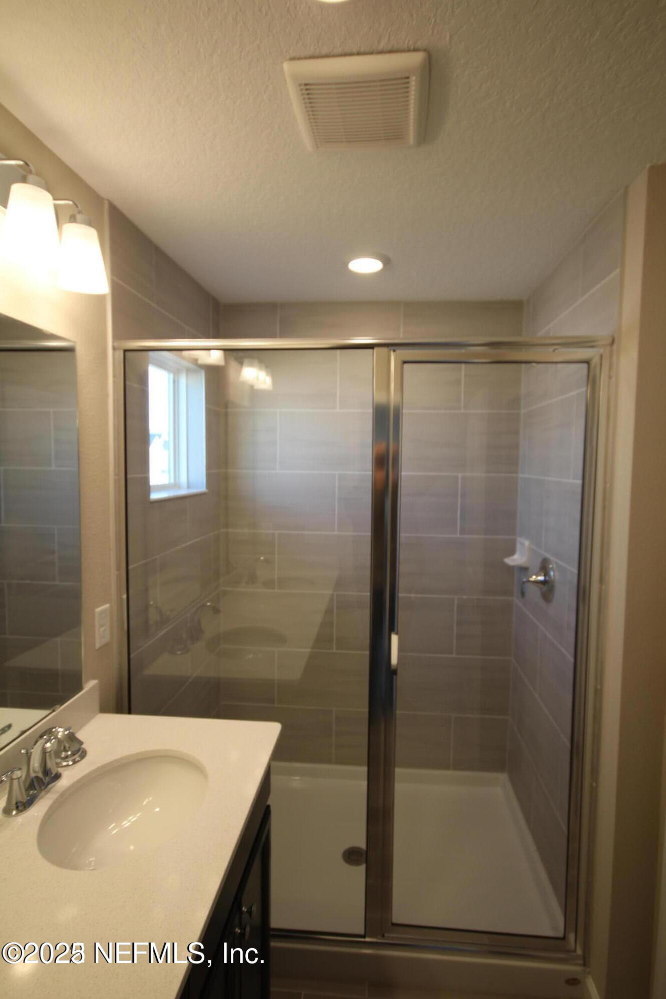 98 Boracay Circle St. Johns, FL 32259 - Photo 21 of 22 a bathroom with a shower and a sink