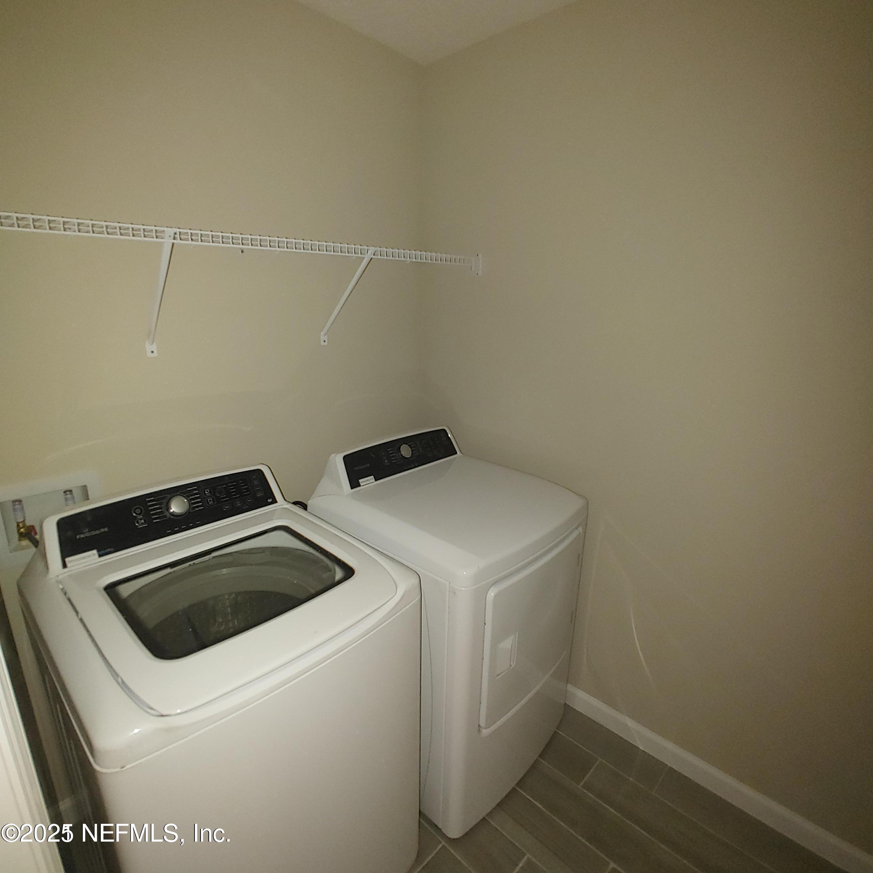 98 Boracay Circle St. Johns, FL 32259 - Photo 22 of 22 a utility room with dryer and washer