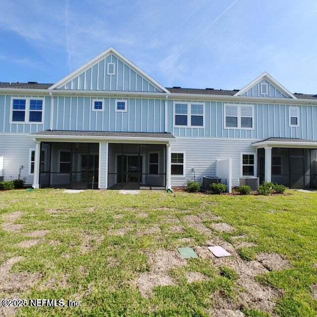 98 Boracay Circle St. Johns, FL 32259 - Photo 3 of 22 a front view of a house with a garden
