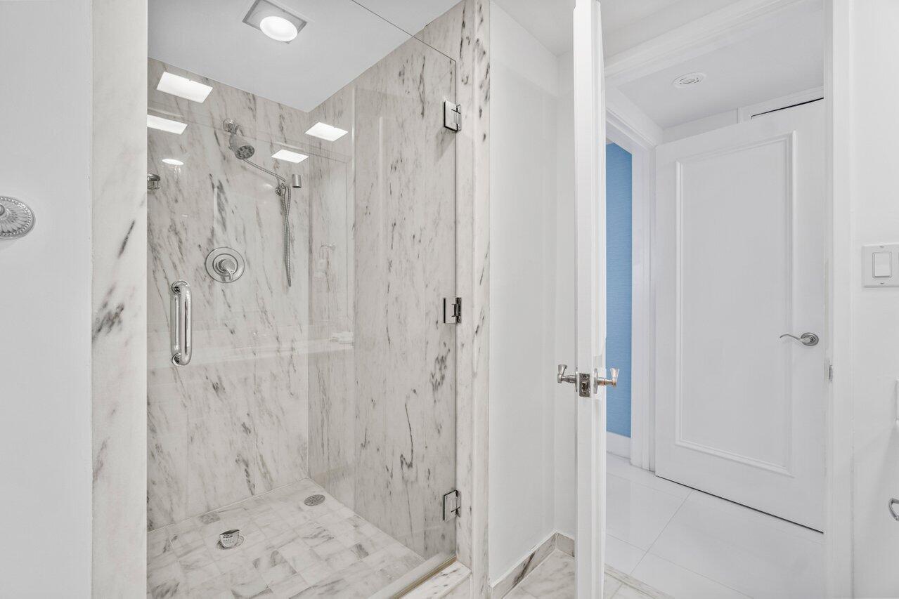 700 South Ocean Boulevard, Unit 405 Boca Raton, FL 33432 - Photo 26 of 59 a bathroom with a shower