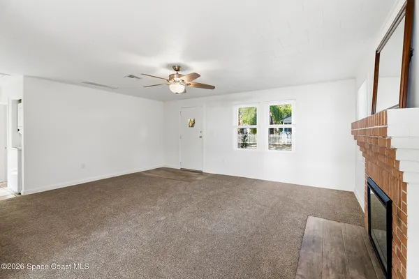 a view of an empty room with a window