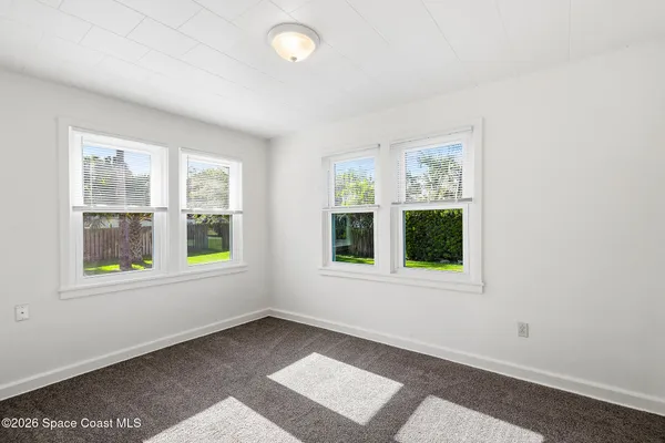 an empty room with windows