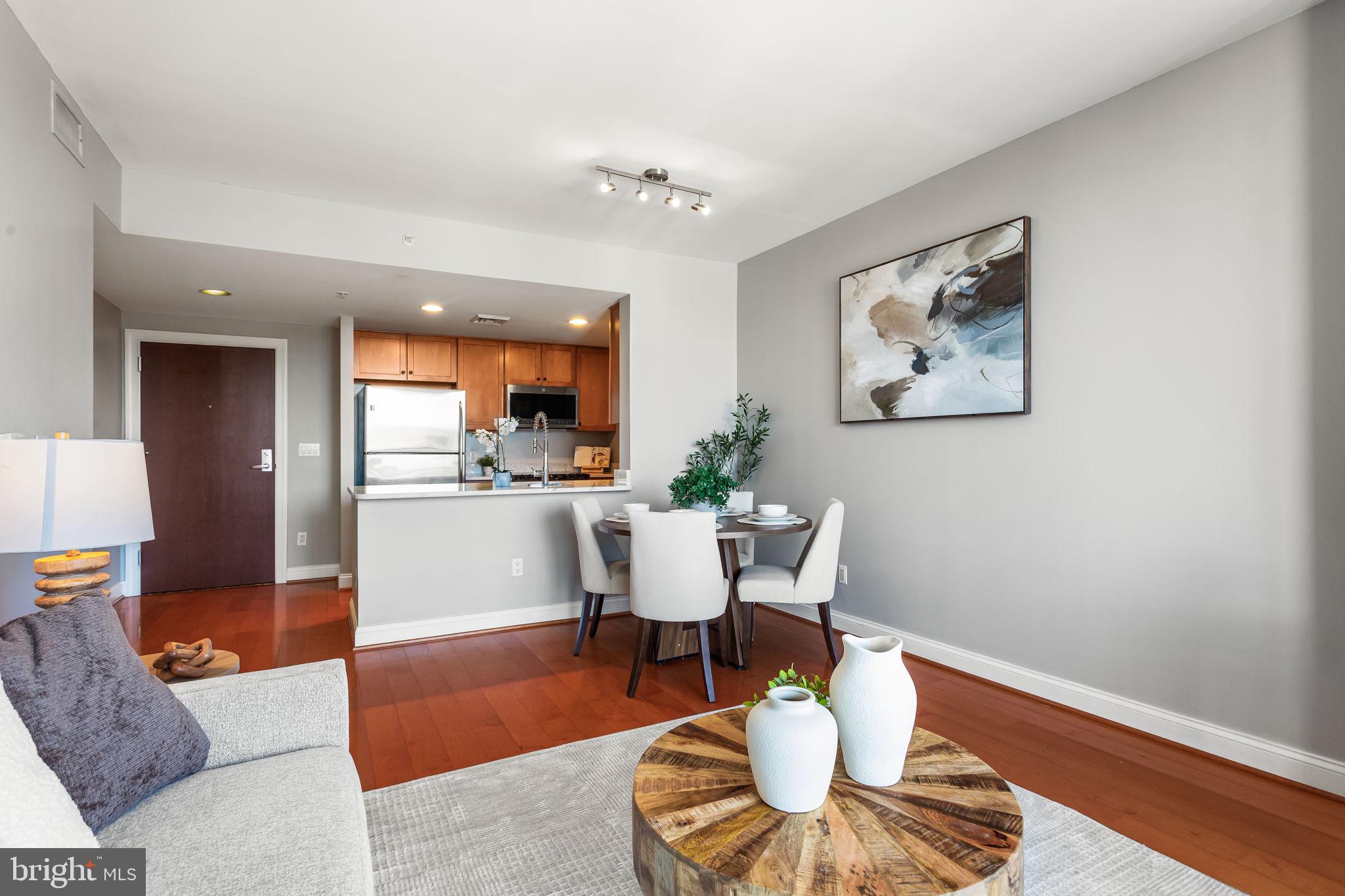 1020 North Highland Street, Unit 621 Arlington, VA 22201 - Photo 12 of 50 a living room with furniture and a wooden floor