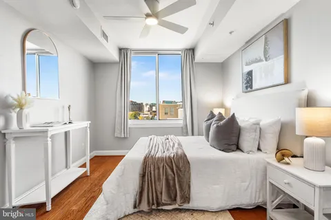 a bedroom with bed and window